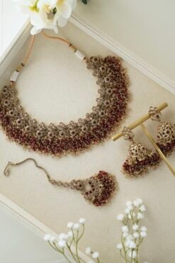 maroon beaded necklace adjustable drawstring south asian jewelry indian pakistani maroon necklace set with jhumka earrings maroon beaded bridal necklace with tikka and earrings south asian maroon beaded necklace gold tone detailing desi maroon necklace jhumka earrings