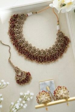 maroon beaded necklace adjustable drawstring south asian jewelry indian pakistani maroon necklace set with jhumka earrings maroon beaded bridal necklace with tikka and earrings south asian maroon beaded necklace gold tone detailing desi maroon necklace jhumka earrings
