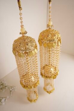 Traditional golden bridal kaleerey with pearls and leaf motifs