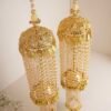 Traditional golden bridal kaleerey with pearls and leaf motifs