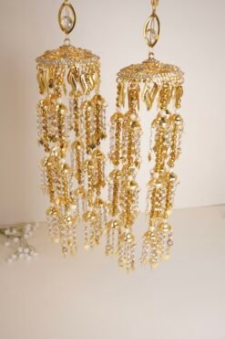 Close-up of gold kaleerey with tiny pearls and leaves