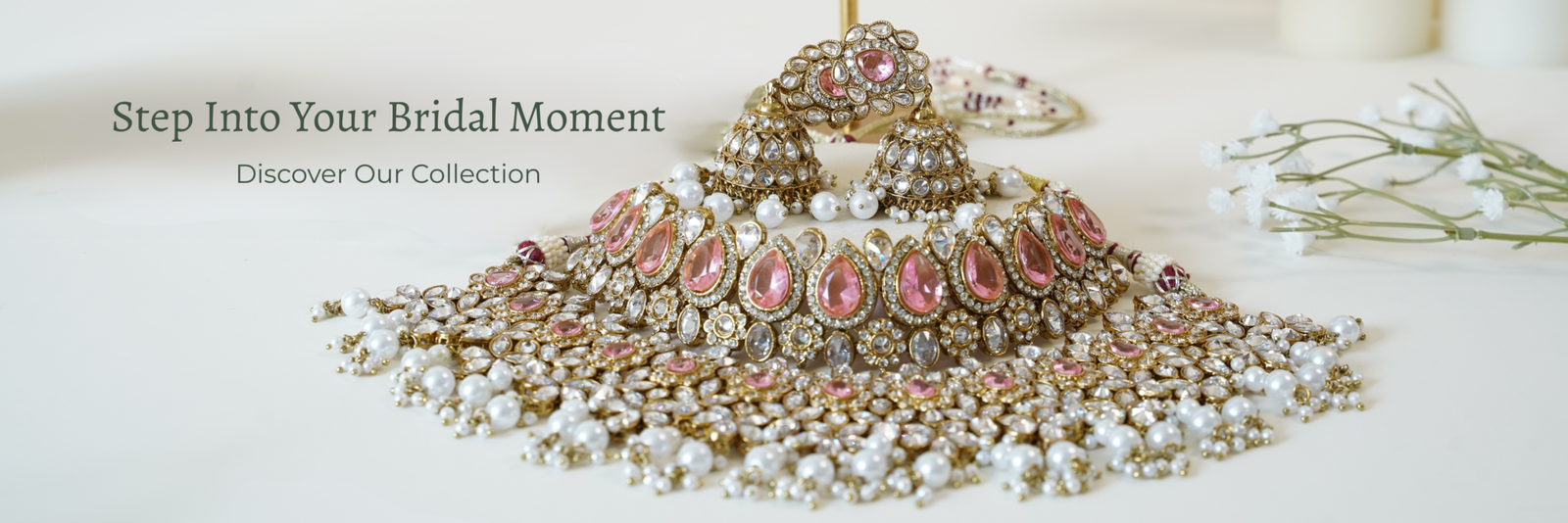 Indian bridal double layer necklace set featuring intricate gold-toned detailing and sparkling pink stones, perfect for brides, weddings and festive occasions