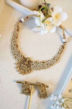 Detailed view of ethnic temple necklace showcasing intricate pearl clusters