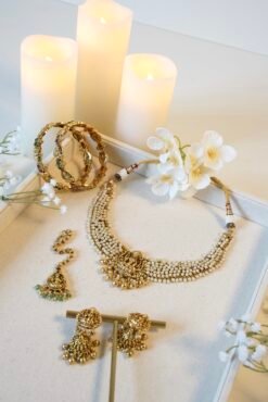 Detailed view of ethnic temple necklace showcasing intricate pearl clusters