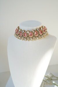 Two-layer Indian Pakistani bridal necklace set with pink stones featuring matching earrings and tikka, adjustable drawstring design for versatile styling