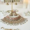 Two-layer bridal Indian Pakistani necklace set with pink stones featuring matching earrings and tikka, adjustable drawstring design for versatile styling