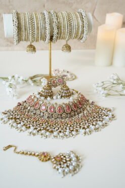 Two-layer bridal Indian Pakistani necklace set with pink stones featuring matching earrings and tikka, adjustable drawstring design for versatile styling
