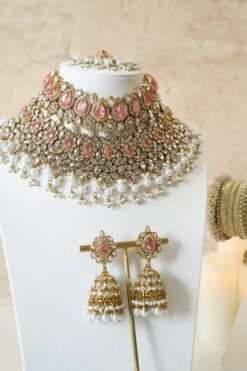 Two-layer bridal Indian Pakistani necklace set with pink stones featuring matching earrings and tikka, adjustable drawstring design for versatile styling