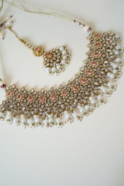 Two-layer bridal Indian Pakistani necklace set with pink stones featuring matching earrings and tikka, adjustable drawstring design for versatile styling