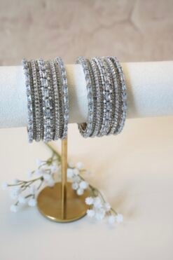 Colorful customizable bangle set with mix and match stackable bangles in vibrant shades and gold accents