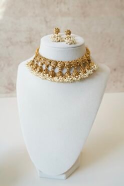 Gold tone mini multi jhumka necklace set with matching earrings, featuring delicate hanging jhumka drops for a traditional yet modern look