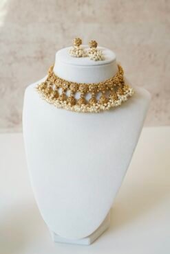 Gold tone mini multi jhumka necklace set with matching earrings, featuring delicate hanging jhumka drops for a traditional yet modern look