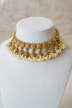 Gold tone mini multi jhumka necklace set with matching earrings, featuring delicate hanging jhumka drops for a traditional yet modern look