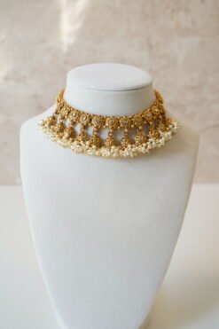 Gold tone mini multi jhumka necklace set with matching earrings, featuring delicate hanging jhumka drops for a traditional yet modern look