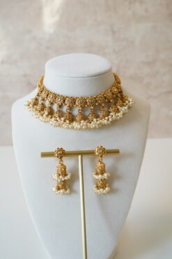 Gold tone mini multi jhumka necklace set with matching earrings, featuring delicate hanging jhumka drops for a traditional yet modern look