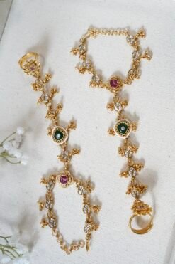 Adjustable gold haathphool hand jewelry with intricate ethnic design, perfect for Indian and Pakistani bridal wear
