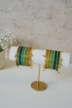Forest-inspired Kashmiri raindrop glass bangle stack in light green, mehndi green, mint, and soft yellow, ideal for weddings, festive occasions, and traditional Indian or Pakistani outfits