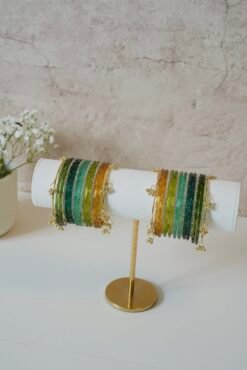 Forest-inspired Kashmiri raindrop glass bangle stack in light green, mehndi green, mint, and soft yellow, ideal for weddings, festive occasions, and traditional Indian or Pakistani outfits