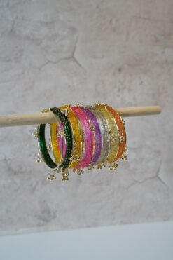 Colorful Rangeela Kashmiri glass bangle set featuring vibrant jewel tones and ghungroo accents, ideal for bridal, festive, or traditional Indian and Pakistani occasions