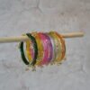 Colorful Rangeela Kashmiri glass bangle set featuring vibrant jewel tones and ghungroo accents, ideal for bridal, festive, or traditional Indian and Pakistani occasions