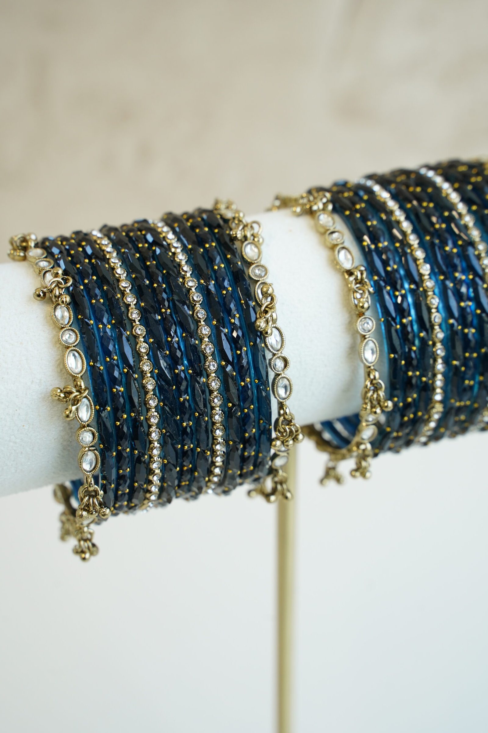 Blue glass bangle stack with delicate ghungroo accent bangles for weddings, mehendi events, and festive wear.