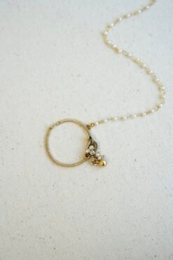 Medium sized floral Kundan nath with a matte gold polish finish and a single layer chain by Seyora Jewels.