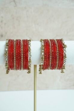 Red glass bangle stack with delicate ghungroo accent bangles for weddings, mehendi events, and festive wear.