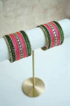 green and pink glass bangle stack with statement kundan centerpiece bangles for weddings and festive wear.
