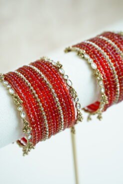 Red Glass bangle stack with delicate ghungroo accent bangles for weddings, mehendi events, and festive wear.