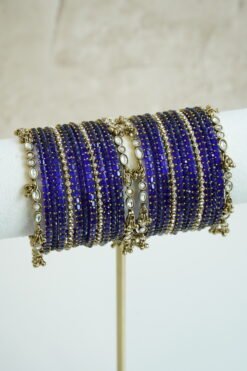 Blue glass bangle stack with delicate ghungroo accent bangles for weddings, mehendi events, and festive wear.