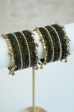 Mehndi green glass bangle stack with delicate ghungroo accent bangles for weddings, mehendi events, and festive wear.