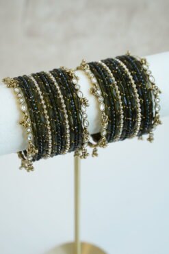 Mehndi green glass bangle stack with delicate ghungroo accent bangles for weddings, mehendi events, and festive wear.