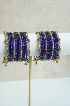 Blue glass bangle stack with delicate ghungroo accent bangles for weddings, mehendi events, and festive wear.