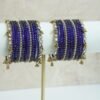 Blue glass bangle stack with delicate ghungroo accent bangles for weddings, mehendi events, and festive wear.