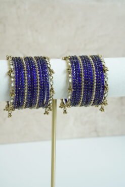 Blue glass bangle stack with delicate ghungroo accent bangles for weddings, mehendi events, and festive wear.