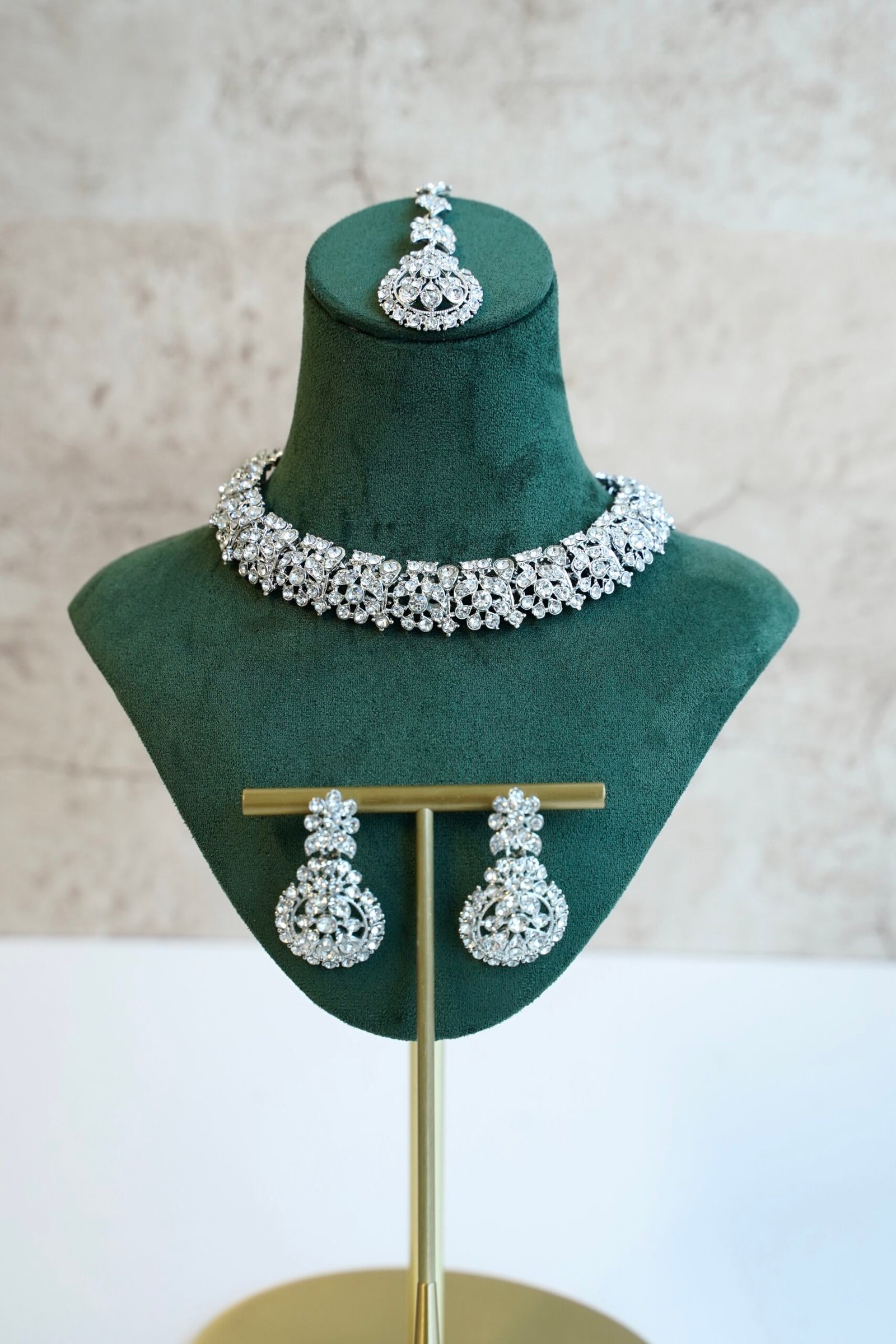 Delicate silver-plated petite stone necklace set with matching sparkly drop earrings and small pendant tikka.
