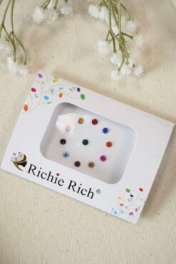 Multi color bindis with matching color stone settings.