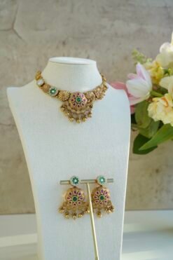 Heritage necklace set with pink green stones and mother of pearl accents in yellow gold finish with matching earrings