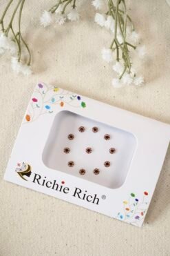 Maroon bindi with glittering crystal stone border and settings.