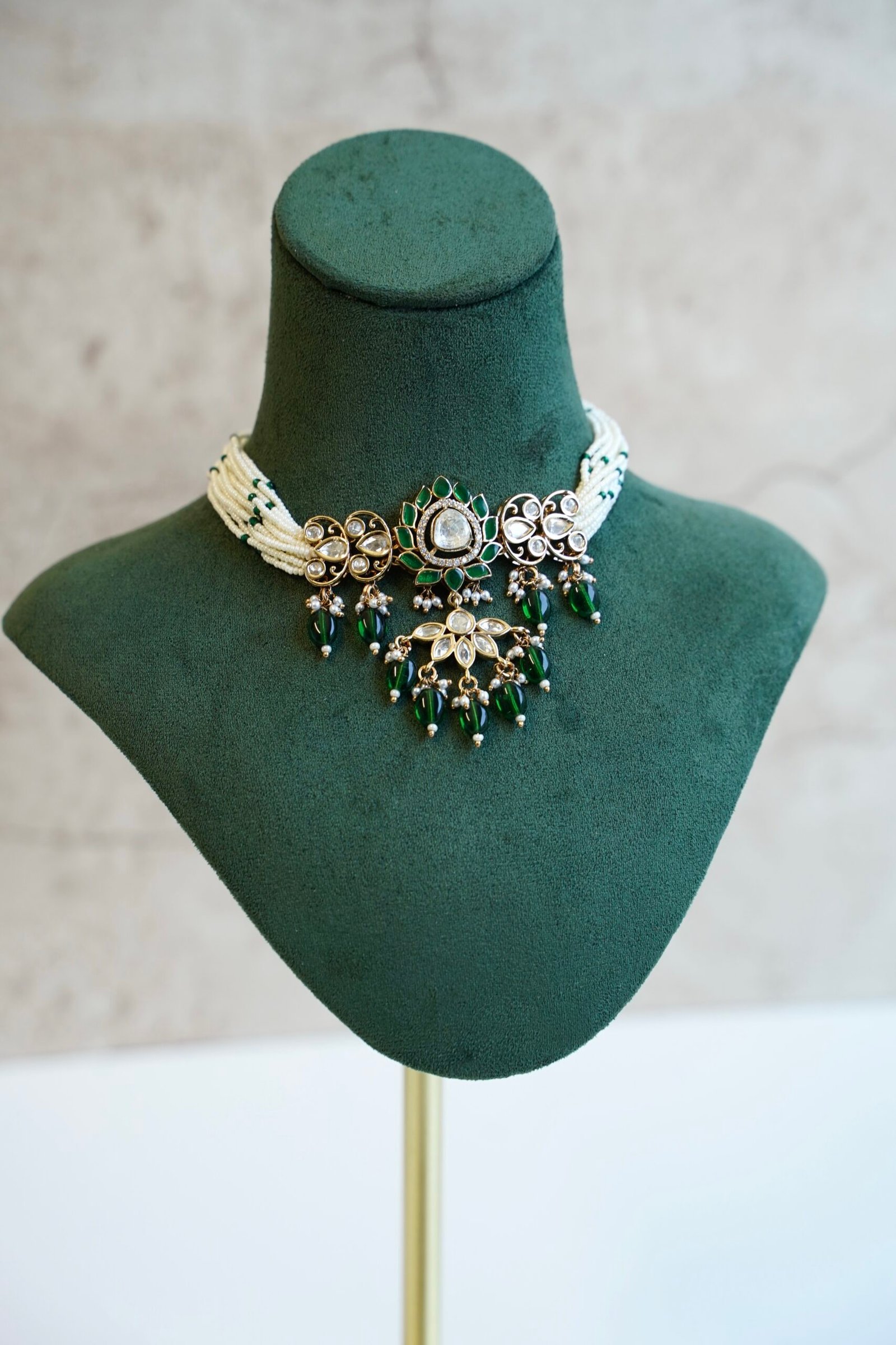 Elegant green beaded choker necklace and matching earrings featuring a lotus Kundan centerpiece by Seyora Jewels.