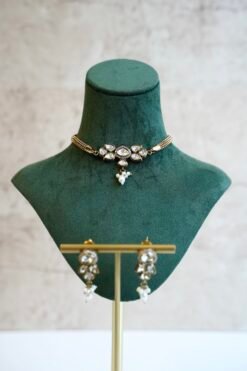 Dainty mini Kundan necklace with an adjustable chain and a pair of matching classic earrings by Seyora Jewels.