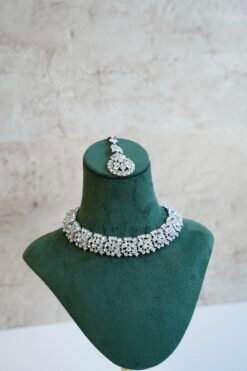Delicate silver-plated petite stone necklace set with matching sparkly drop earrings and small pendant tikka.