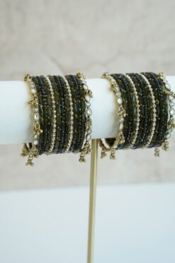 Mehndi green glass bangle stack with delicate ghungroo accent bangles for weddings, mehendi events, and festive wear.