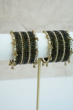 Mehndi green glass bangle stack with delicate ghungroo accent bangles for weddings, mehendi events, and festive wear.