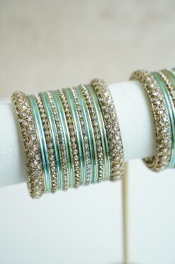 Blue metal bangle stack featuring statement kata bangles on each end, perfect for summer weddings and festive occasions.