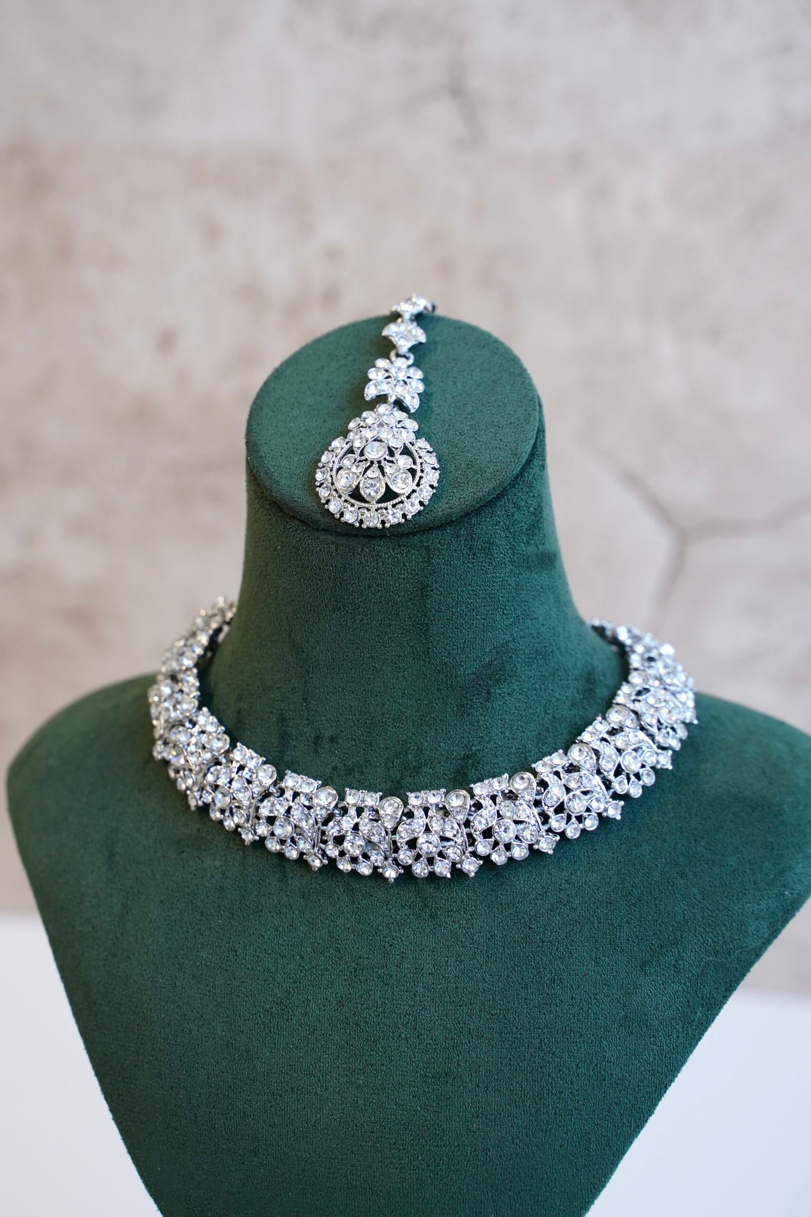 Delicate silver-plated petite stone necklace set with matching sparkly drop earrings and small pendant tikka.