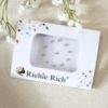 Small bindi pack featuring a tiny central pearl surrounded by a silver stone setting.