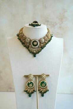 Lightweight green artificial Kundan necklace set with matching drop earrings and Maang Tikka for South Asian weddings.