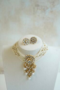 Seyora Jewels modern pachi kundan beaded choker necklace featuring a 3.5-inch floral centerpiece with hanging beads and matching square floral earrings.