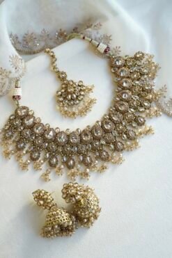 Seyora Jewels Tanya necklace set featuring champagne stones and hanging champagne crystal beads with matching jhumka earrings and maang tikka.
